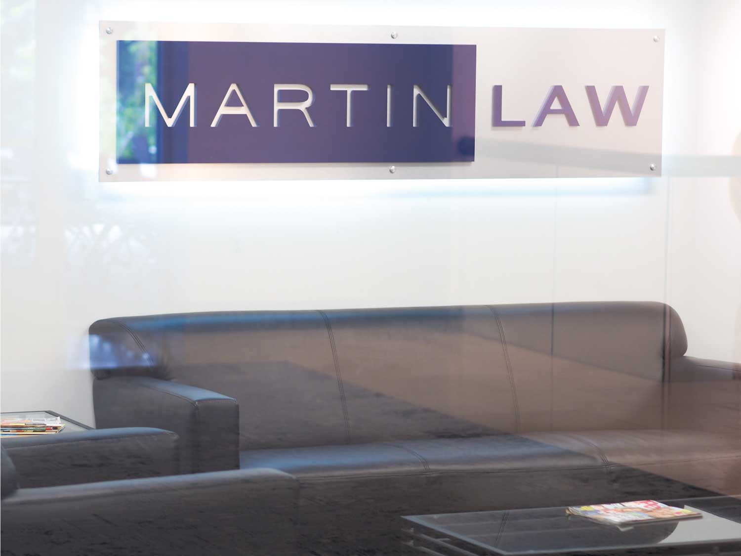 Martin Law Logo Design Sign Through Glass Doors